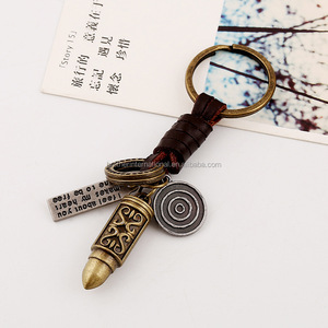 विंटेज हस्तनिर्मित धातु बुलेट आकर्षण कुंजी श्रृंखला पुरुषों की ब्रेडेड चमड़े की रस्सी कुंजी अंगूठी कांस्य मिश्र धातु बुलेट काउहाइड - Product Image 2