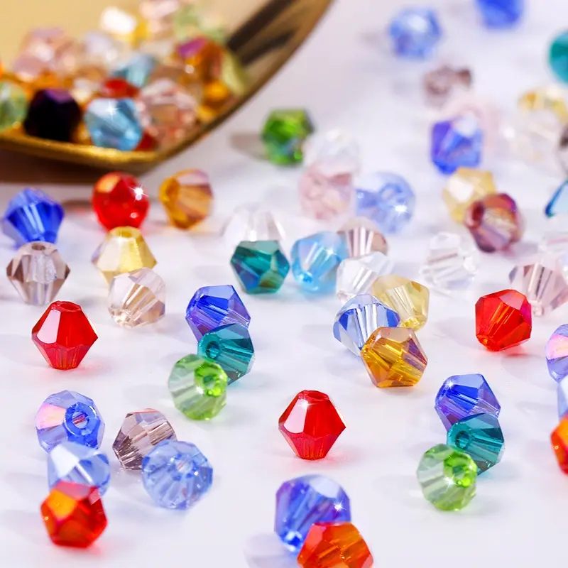 Cuentas bicono facetadas de cristal sueltas de cristal de colores chapados al por mayor para la fabricación de joyas