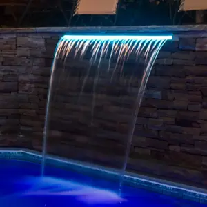 Outdoor swimming pool waterfall cascade