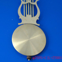 Péndulo de reloj de latón antiguo y metal