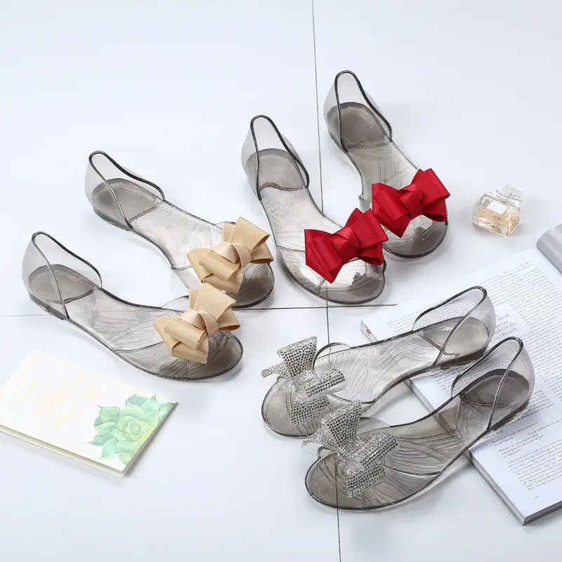 Sandal wanita musim panas baru sepatu Jelly Pvc dekorasi pita berlian imitasi sandal mulut ikan transparan sandal hak datar