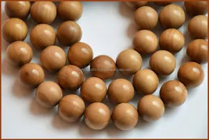 Vente en gros de chapelets en bois de santal Riddhi Siddhi - Perles rondes de couleur jaune foncé à brun doré foncé, fabriquées au Rajasthan - Product Image 2