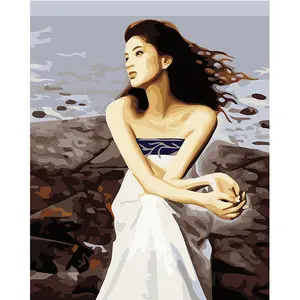 Moderno retrato diy pintura al óleo por números 3d hermosa chica en vestido blanco sentarse en la playa bonita foto