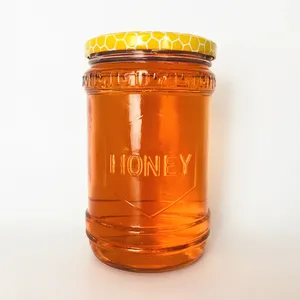 Pot en verre transparent vide de 600 ml en gros, forme unique, stockage de miel avec couvercle à logo design - Product Image 1