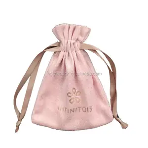 small pink velvet jewelry pouch with tassel drawstring