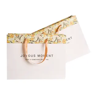 Sacchetto di carta da stampa personalizzato con manico a nastro borsa per la spesa per abbigliamento elegante sacchetto regalo floreale colorato