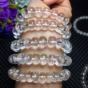 Al por mayor cristal natural 10.8-11.8mm blanco claro cristal poliedro oval pulsera de los granos - Product Image 1
