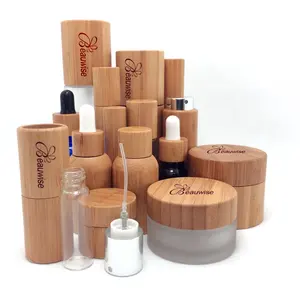 Venta caliente botellas de cosméticos de bambú y madera biodegradables, fábrica personalizada todas las botellas de agua de vidrio envueltas en Bambú