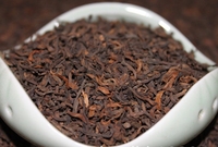 Entrepôt séché Stockage Yunnan Vieilli Pu Er Thé Feuilles en vrac Fermenté Mûr Puer Feuilles de thé noir Cuit Shu Puer Tea
