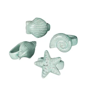 Ensemble de 4 anneaux de serviette en porcelaine, vaisselle avec coquille de mer, en céramique - Product Image 1