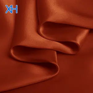 Xinheテキスタイルによるホットファッション100% シャルムーズサテンシルク生地卸売