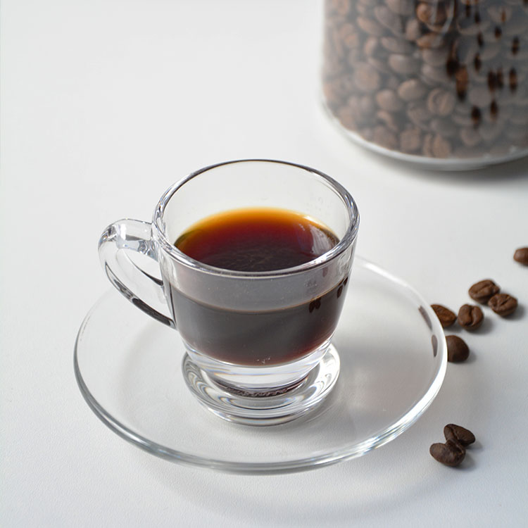 Clear glass coffee cup set with handle and saucer