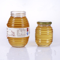 Venta al por mayor, 100 ml200ml350ml730ml, tarro vacío de cristal transparente con forma de abeja, personalizado, envase de miel