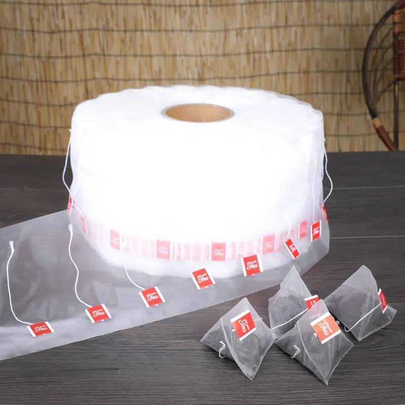 Rouleau de sac de maille de filtre en nylon transparent de qualité alimentaire pour l'emballage de sachets de thé pyramide