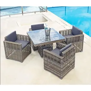 4 plazas gruesa distintivo redondo tejido de Ratán Muebles de jardín comedor mesa con sillas al aire libre