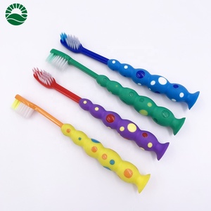 Cepillo de dientes con forma de palos para niños, con tomates clásicos y ventosas - Product Image 2
