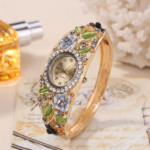 Donne Della Vigilanza Del Braccialetto Del Fiore Del Rhinestone Dell'oro di modo Classico <span class=keywords><strong>Orologio</strong></span> Da Polso del Vestito Della Vigilanza del Quarzo (KKWT82077)