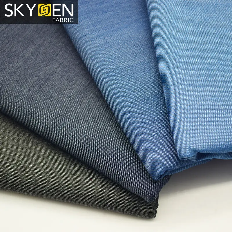 Skygen Guangzhou stocklot wholesale twill weave 100% jutecell indigo soft denim fabric for shirts dress