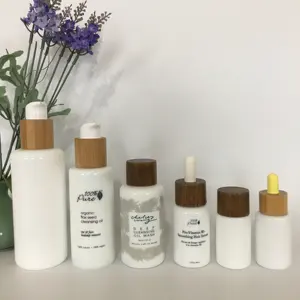 Factory hot koop ronde essentiële olie opaal witte lotion glazen fles met bamboe en hout pomp