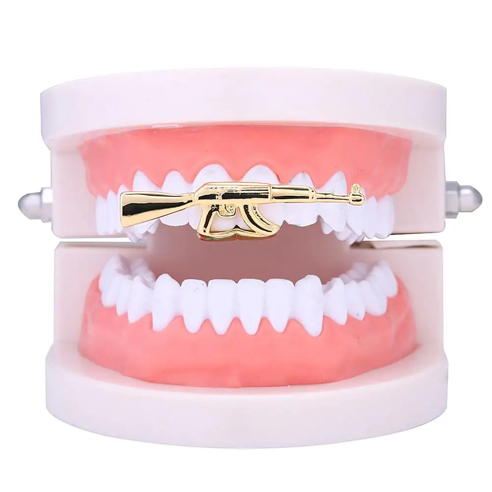 الجملة بس مجوهرات النحاس Ak-47 أعلى الأسنان Grillz 18K مطلية بالذهب مزدوجة الأسنان الهيب هوب 14k الذهب مطلي الأسنان بندقية Ak47 الشوايات