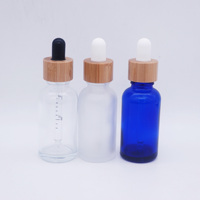Verre de bouteille bleu de 50ml pour huile essentielle avec couvercle en bambou