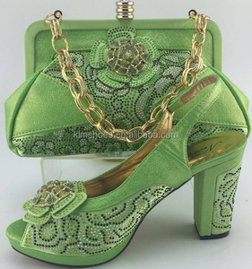 green shoes and matching bolsa