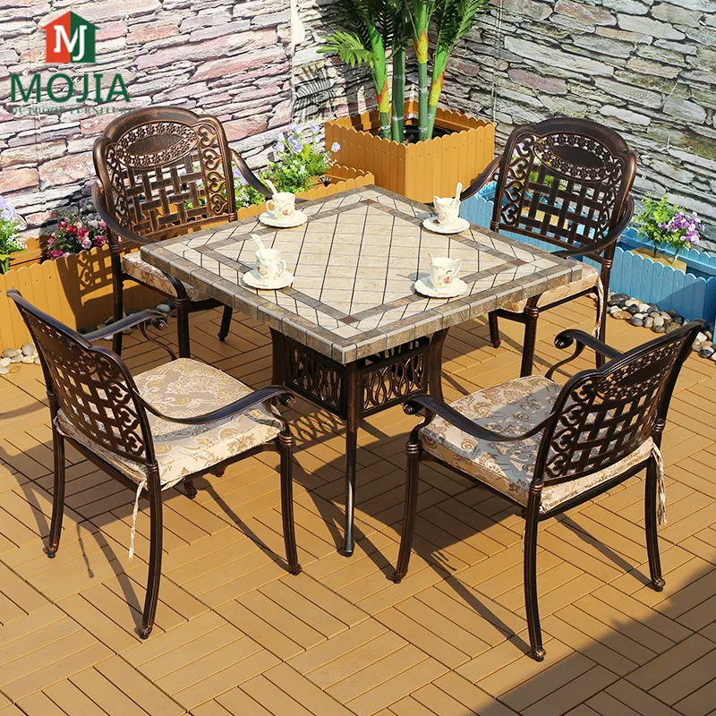 佛山ガーデンストーンテーブルと椅子ガーデン人気のブロンズパティオガーデンテーブル & チェアディナーセット