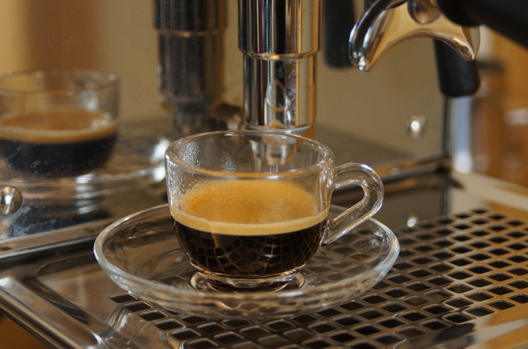 Clear glass coffee cup set with handle and saucer