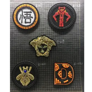 Fujian China Embroidery Label Factories Custom Golden Metallic Thread Fish Shell Logo Round Embroidered Patches For Caps