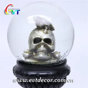 Halloween collectible glass snow globe souvenir with resin skeleton & tombstone design