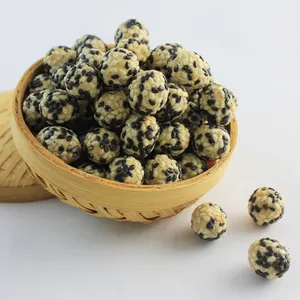 Black and white sesame coated peanut cracker snack