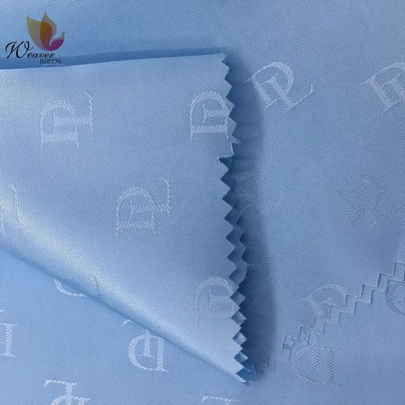 Available100% Polyester Custom Alphabet Logo Jacquard Lining Fabric