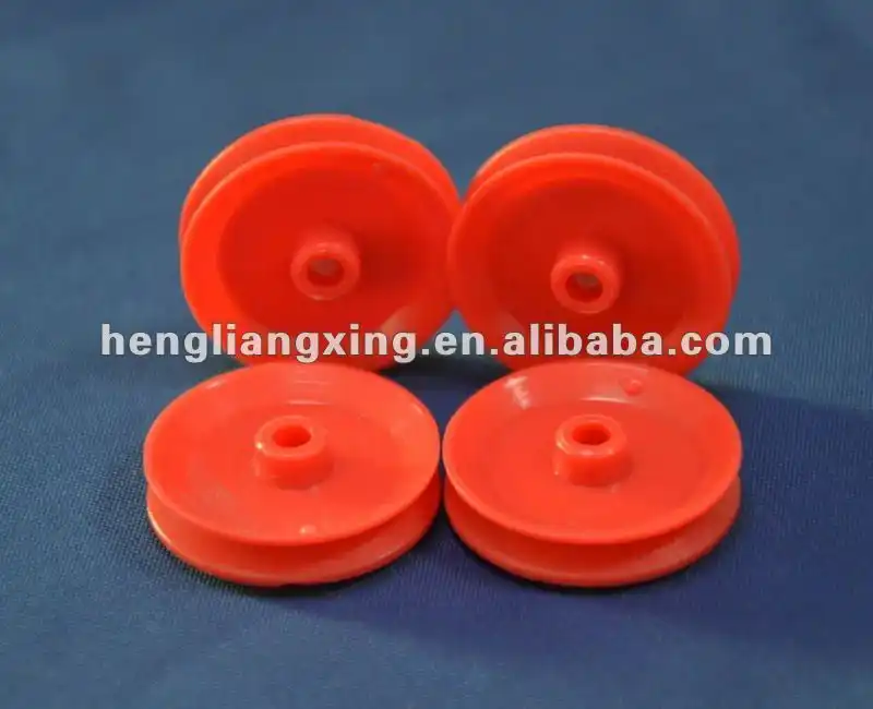 Red plastic pulley wheel for toys