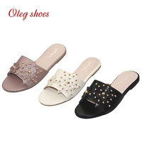 2023 Damen PU Großhandel Flache Sandalen mit Blumendesign Sommer-Slides für Partys und Shopping Damen-Hausschuhe