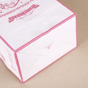 Proveedor de China tela de embalaje de compras de reciclar con mango barato bolsa de papel Kraft blanco - Product Image 4