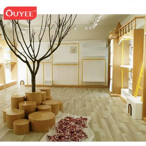 Morder <span class=keywords><strong>Shop</strong></span>-muebles para tienda de ropa de bebé, diseño de sala de exposición, decoración de tienda de ropa para niños con estante de ropa