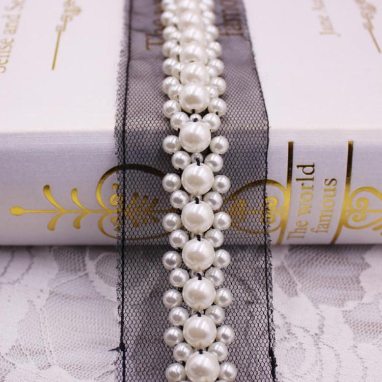 Nero con perla bianca