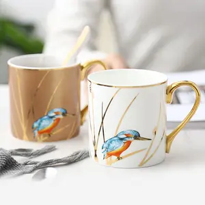 Taza de café china de hueso dorado de lujo, taza de té de cerámica de pájaro con mango