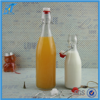 Bouteille en verre vide de 500 ml (17 oz) pour liqueur avec bouchons hermétiques en caoutchouc
