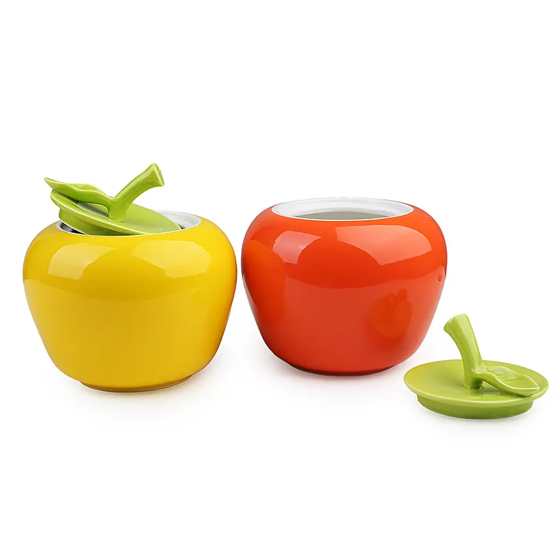 yellow and red glazed ceramic apple cookie jar
