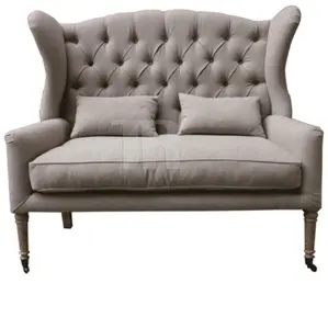 European style solid cabriole legs slight flared wing and deeply buttoned tufted high back banquette