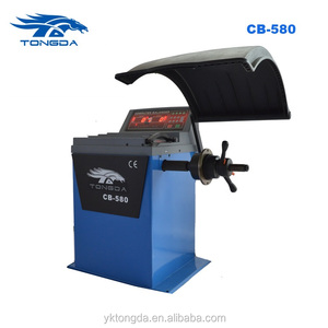 Équilibreuse de roues manuelle Tongda CB 580 avec certification CE, modèle 2017, fabriquée en Chine - Product Image 1