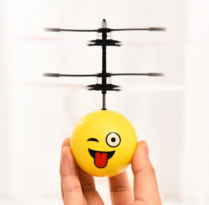 Hot sell induction toys flying ball with light Expression face design sensor flying ball