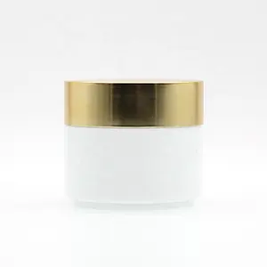 Hot Selling 50g 100g white ceramic cosmetic glass cream jar with plastic lid glass jars and lids aluminum gold cap face care set