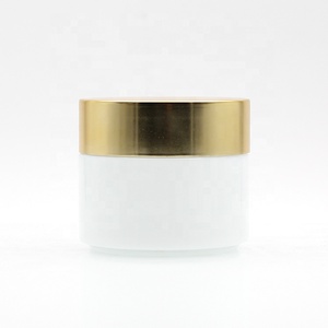 Hot Selling 50g 100g white ceramic cosmetic glass cream jar with plastic lid glass jars and lids aluminum gold cap face care set