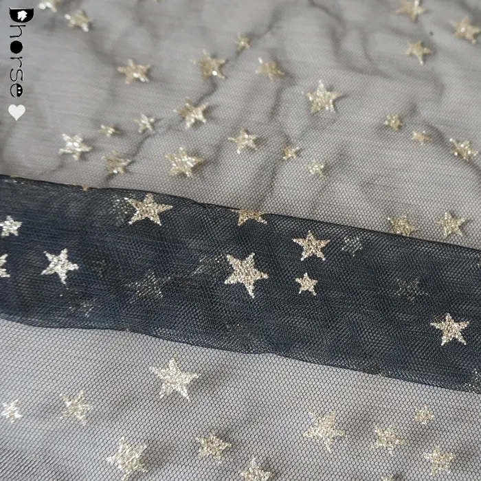 Patrón de estrella de oro al por mayor de China con malla negra de encaje de tela brillante