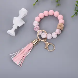 China supplier custom cute wristlet silicone bead bracelet long pu leather tassel boho keychain