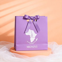 Sac en papier personnalisé découpé à la forme avec poignée, idéal pour l'emballage de bijoux de luxe, sac cadeau en papier avec ruban et nœud