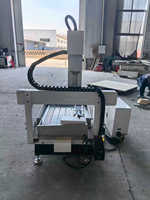 Nouvelle machine de gravure et de fraisage CNC multifonctionnelle de bureau 6090 à 4 axes avec changement automatique d'outils pour cylindres plats