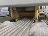 Ligne d'extrusion à double vis BOGDA contrôlée par PLC pour la fabrication de panneaux muraux rainurés en PVC WPC